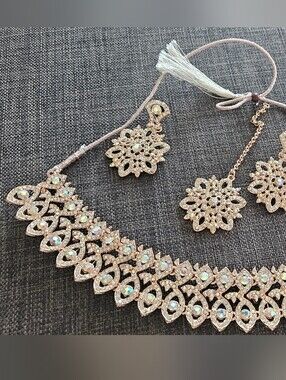 Earrings, necklace, and tikka set with rhinestones
